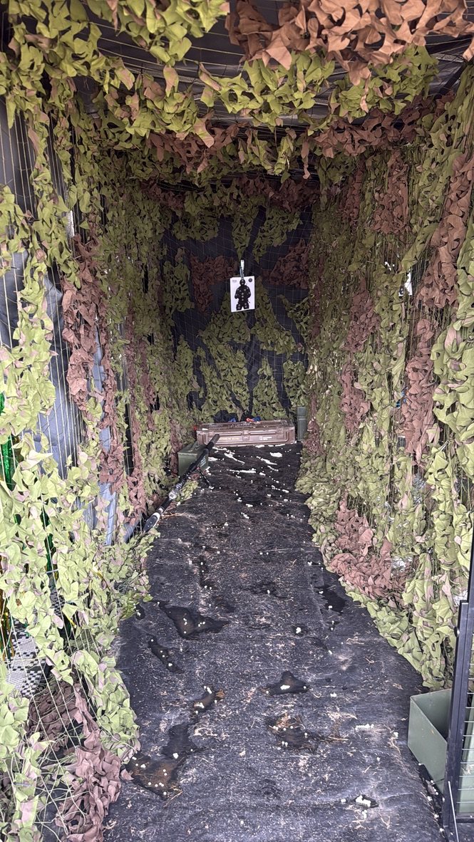 Looking down the enclosed shooting lane at the paper targets