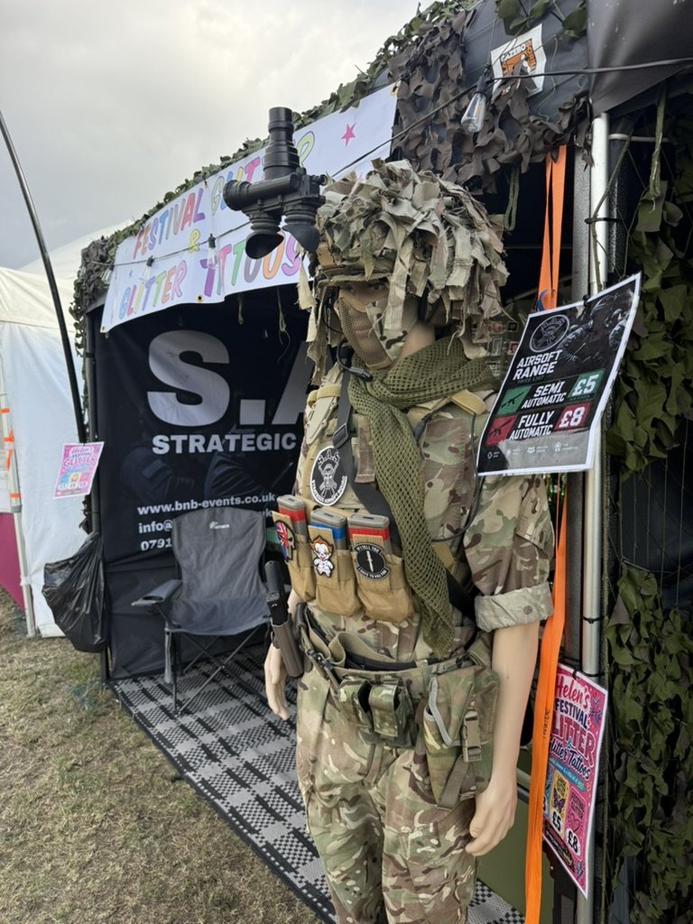 An S.A.S. marshal in full kit beside the stand