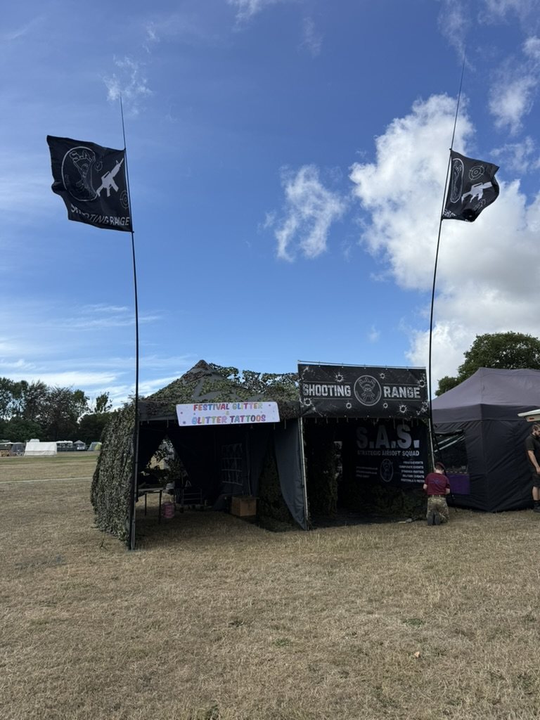 The range pitched in a show field with flags flying