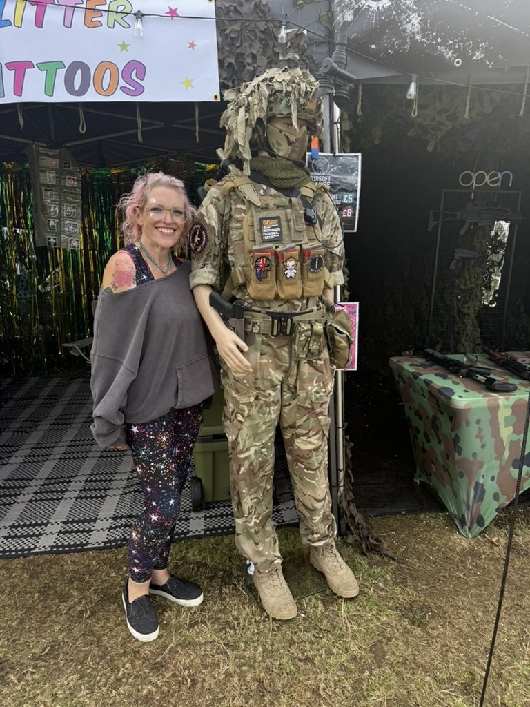 A visitor posing with one of the S.A.S. team in full kit